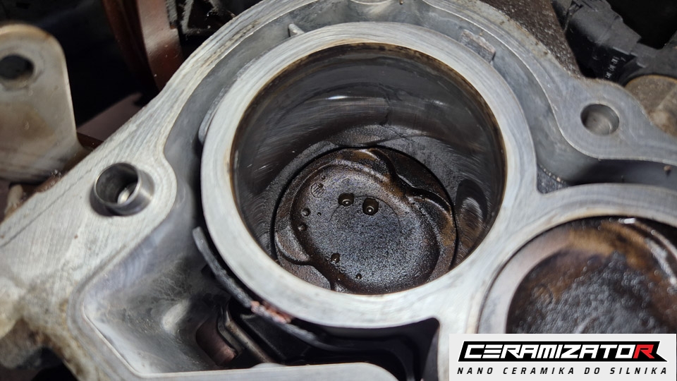 A cylinder bore and piston crown with the head removed